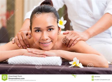 indonesian woman wellness massage in spa stock image