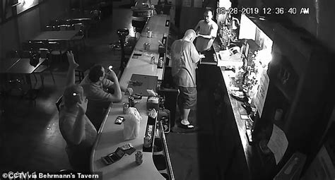 video shows st louis man smoking a cigarette while an armed robber