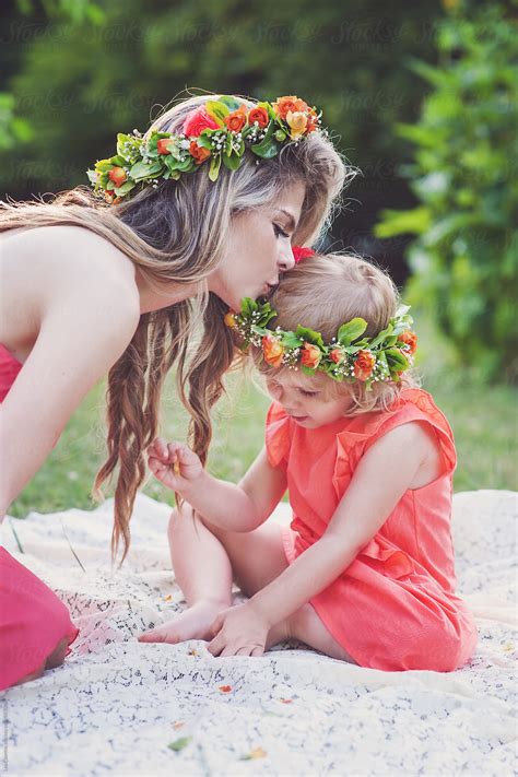 view beautiful mother kissing her lovely daughter s head both wearing
