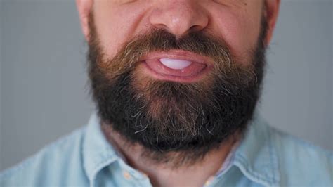Close Up Of A Bearded Man S Mouth Chewing Chewing Gum A