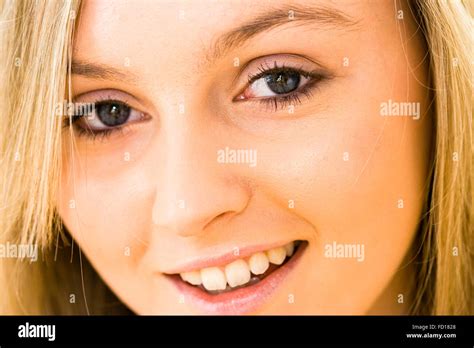 close up of face of very pretty 16 18 year old blonde girl with blue