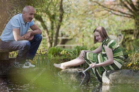 Old Man And Young Girl At Pond Stock Image F003 7453 Science