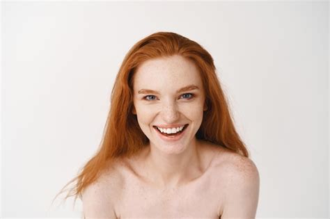 Free Photo Beautiful Redhead Woman Winking Smiling Showing Hare Hands