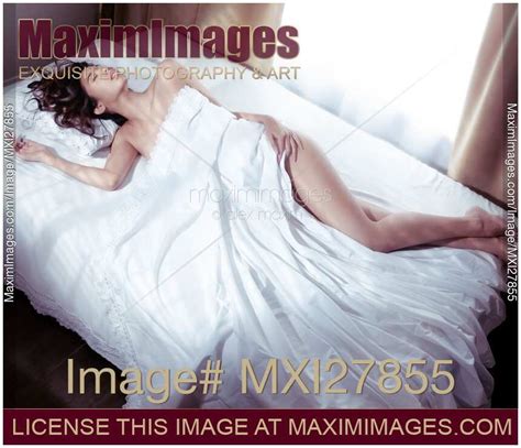 Photo Of Beautiful Woman Sleeping Naked In Bed Covered With White