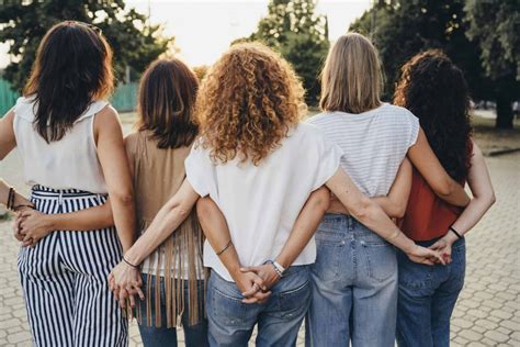 group  women friends holding hands   sunset