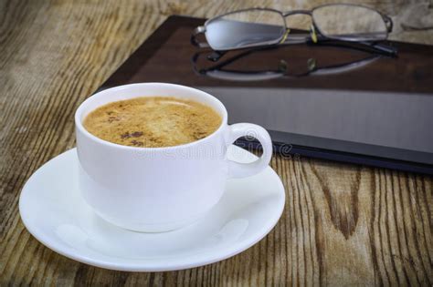 hipster woman in a sunglasses with a coffee and tablet