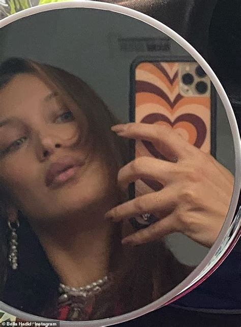 bella hadid is a glamorous girl in pearls as she snaps smoldering