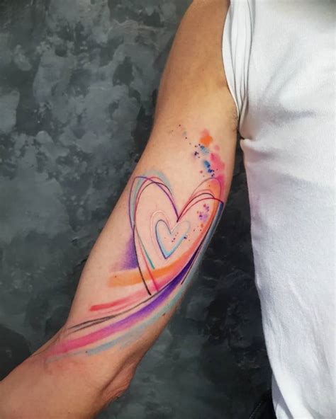 Watercolor Hearts Tattoo Located On The Inner Arm