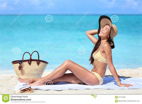 beach bikini woman sun tanning on summer vacation stock