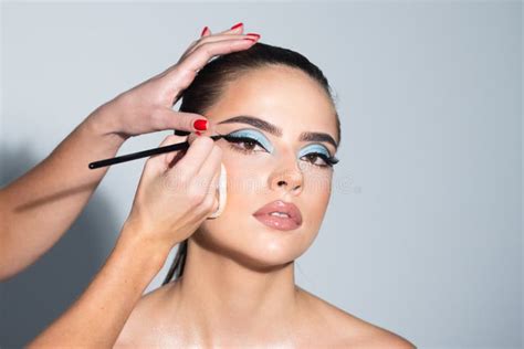 Beautiful Woman Face With Perfect Makeup Makeup Artist Applies Eye