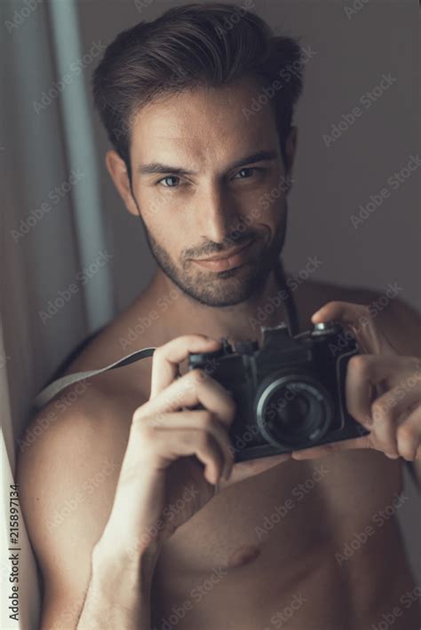 Sexy Nude Man An Amateur Photographer Holding An Slr Camera Stock