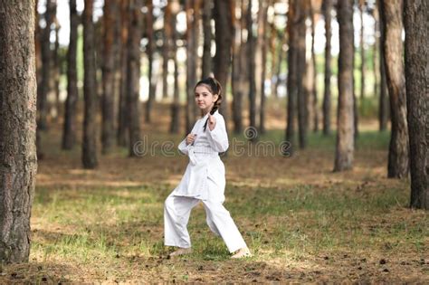 Girl In Kimono Practicing Karate On Tatami Outdoors Stock Image Image
