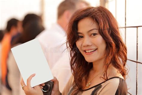 woman showing blank page stock image image  advertising