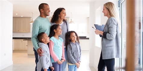 female realtor showing family interested  buying  house picture