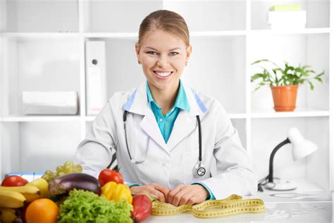 happy smiling female dietitian  uniform  stethoscope  workplace