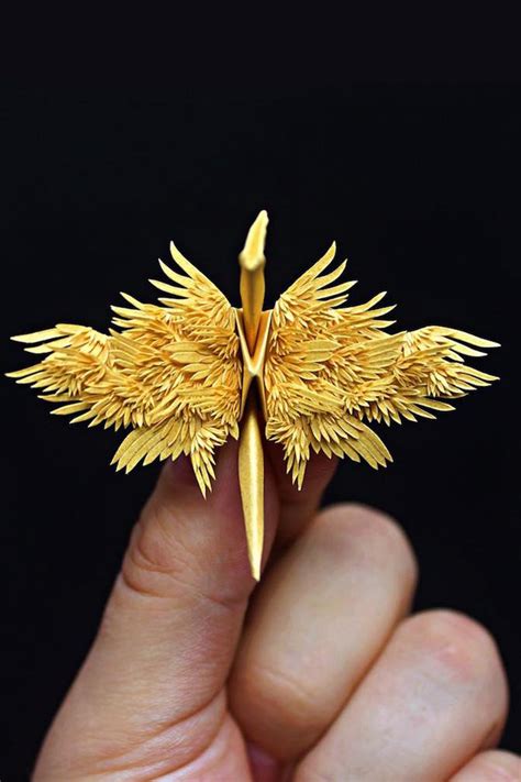 artist creates   amazing paper cranes  feathery details