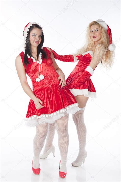 two sexy santa girls having fun on a christmas party