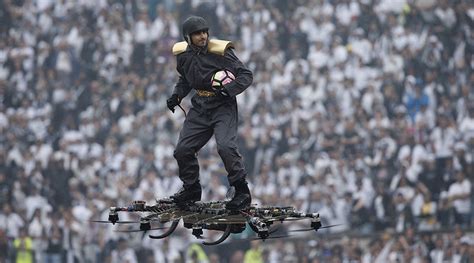 man  drone delivers soccer ball  stadium  dramatic stunt video rt sport