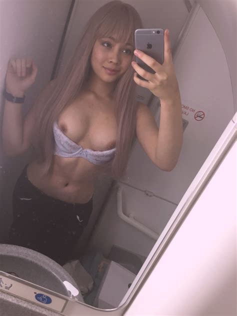 asian teen selfie in airplane bathroom g48r13l