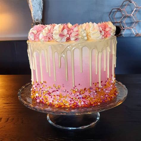 pink and cream drip cake featuring various baking time club cake
