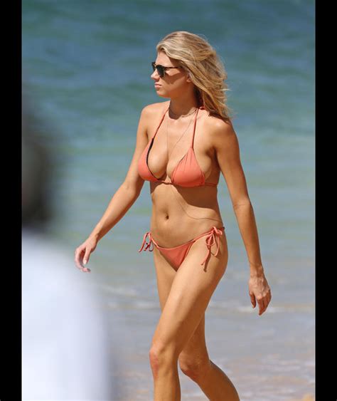 a bikini clad charlotte mckinney flaunts her body on the beach with a mystery man in hawaii