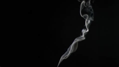 plumes of smoke in super slow motion rising against a