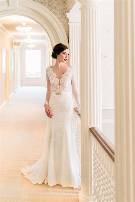 A Modern Real Papilio Bride Wearing A Fit And Flare Lace Long Sleeved