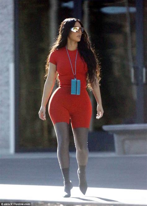 kim kardashian slips her famous curves into a skintight red unitard daily mail online