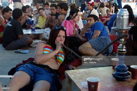 An Israeli Girl Smokes A Water Pipe 25 April 2005 During The