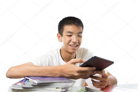 asian teenager using his tablet or ipad and happy to find