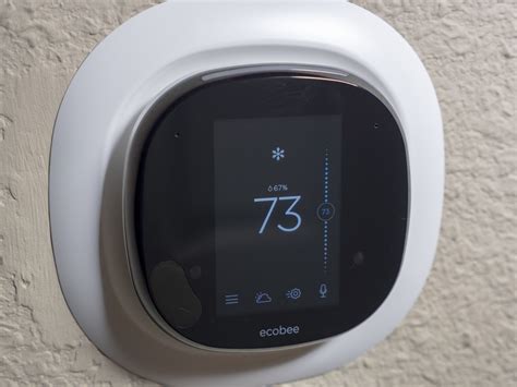 veteran ecobee holds     shiny  nest thermostat