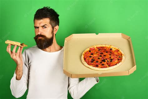 premium photo pizza handsome sexy bearded man   face