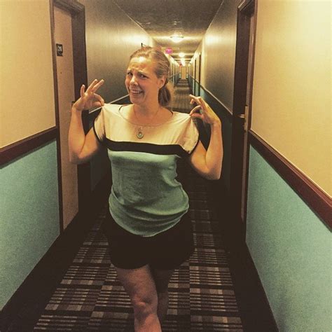 woman s clothes blend into hotel corridor in bizarre wardrobe fail