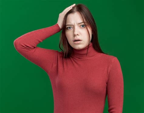 Free Photo Regretting Young Pretty Girl Putting Hand On Head Isolated
