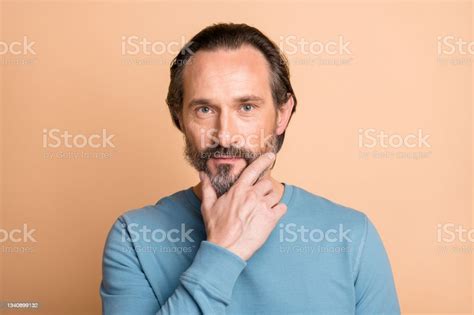 Photo Of Handsome Mature Guy Calm Face Finger Chin Wear Blue Pullover