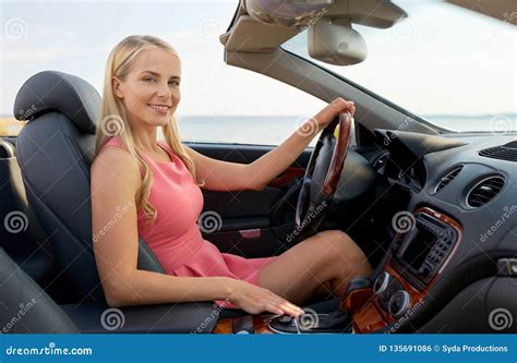 happy young woman driving convertible car stock photo image  drive