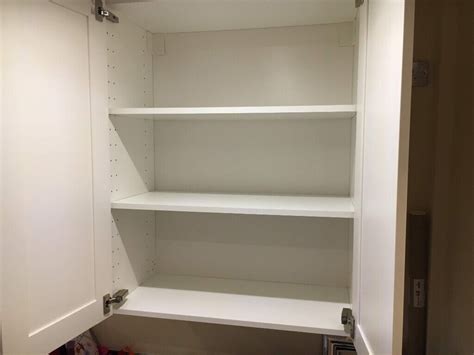 ikea white wall cabinet  shelves  doors  thames ditton