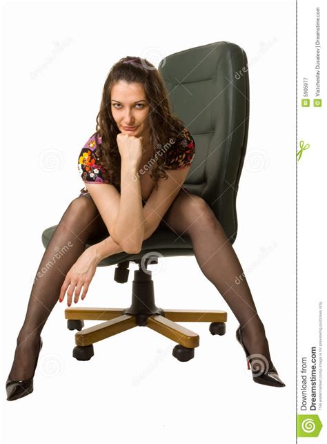 Snazzy Brunette Sitting On The Office Chair Stock Image