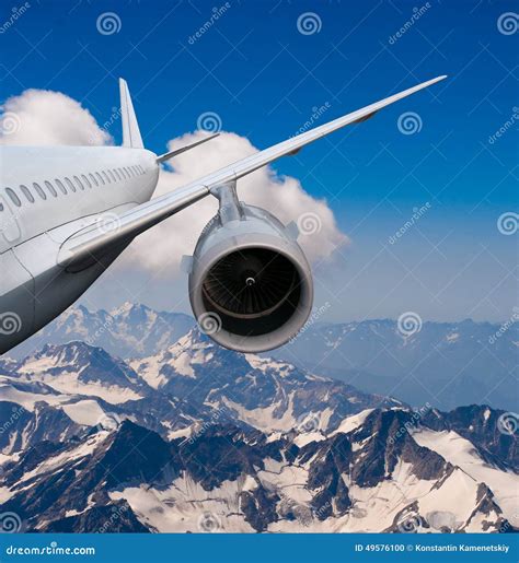 plane flying   snow capped mountains stock photo image  people business