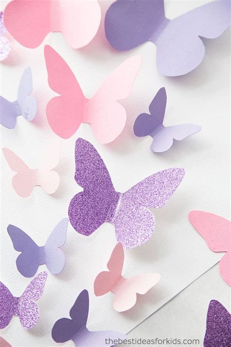 purple  pink paper butterflies  scattered   white surface