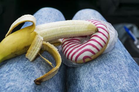 Sweet Doughnut And Peeled Banana Concept Of Sex And Eroticism Stock
