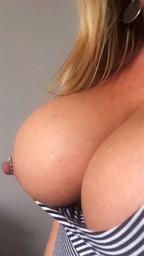 smoking hot blonde exposes her pierced nipple