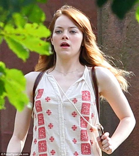 emma stone looks harried as she gets back in character to