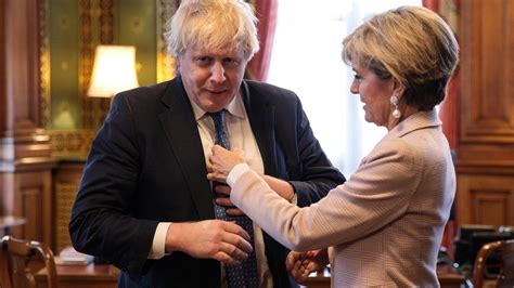 boris johnson helped into his tie by his australian counterpart before