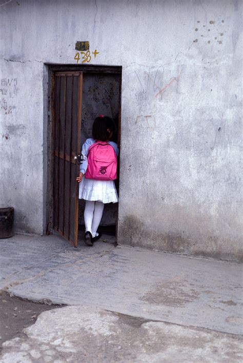 mexican girl in doorway photograph by mark goebel fine art america