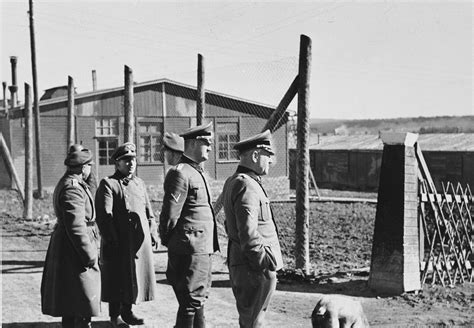 A Group Of Ss Officers Tour The Hinzert Concentration Camp