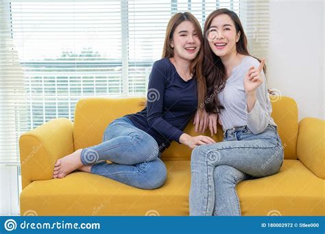 A Couple Of Beautiful Asian Woman Talking While Smiling