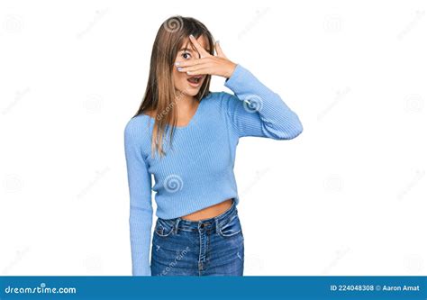 Teenager Caucasian Girl Wearing Casual Clothes Peeking In Shock