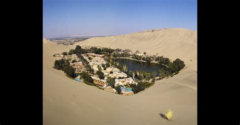 huacachina oasis peru 83 unreal places you thought only existed in