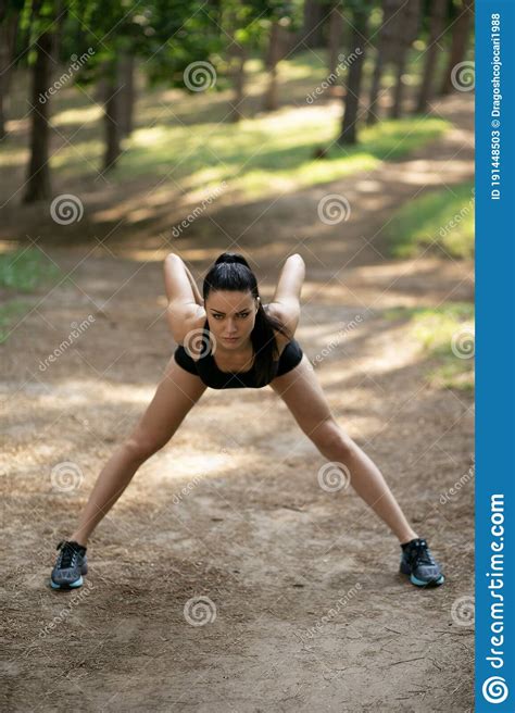 Attractive Girl Practicing Stretches Exercises On Legs Working